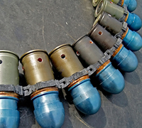 Military ordnance mechanical fuze made of bronze, copper, kovar, and stainless steel