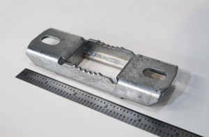 Close up of a small 1008 steel clamp with zinc plating for the industrial controls industry