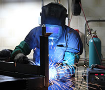 Certified Welder works on a weld fixture assembly
