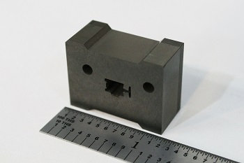 Heat sink manufactured with Wire EDM compared to the original material block