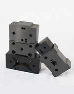 Stacked carbide wire EDM die blocks for the computer hardware industry