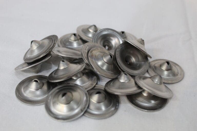 Pile of Wire EDM Cut shower nozzles