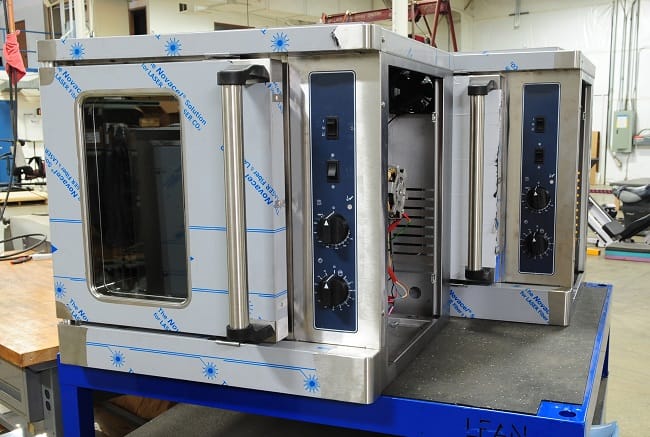 Fabricated assembly of warming ovens for the foodservice industry